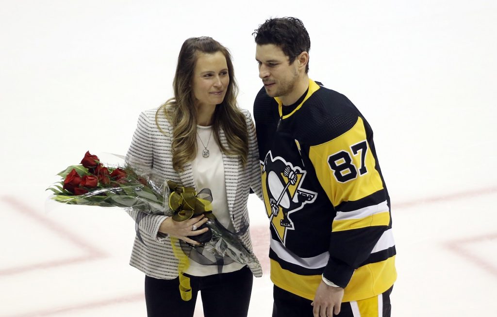 Sidney Crosby with his wife